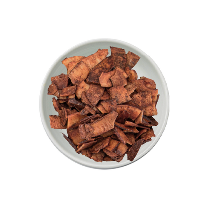 White bowl filled with chocolate coconut chips. Distributed by AFRIVANA
