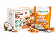 Box and bag of Reelfruit honey sesame coconut chips. Distributed by AFRIVANA